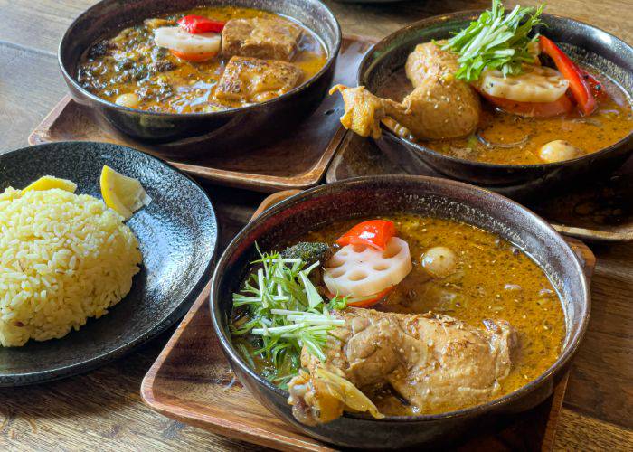 Hokkaido's famous soup curry, featuring large chunks of meat and veggies soaking in a liquid curry broth.